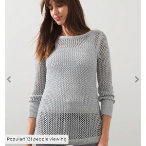 Never worn Chico’s Size 4 (20/22 or XXL) Silver Shiny Sweater Tunic.